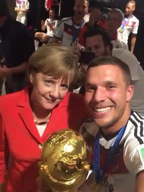 Angela Merkel und Lukas Podolski Weltmeister 2014